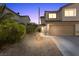 Charming two-story home featuring a two-car garage and low maintenance landscaping at 779 Peregrine Falcon St, Henderson, NV 89015