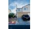 Two story home featuring drought resistant front yard, two-car garage, and covered entryway at 779 Peregrine Falcon St, Henderson, NV 89015