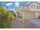 Charming two-story home featuring a two-car garage and low maintenance landscaping at 779 Peregrine Falcon St, Henderson, NV 89015