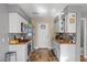 Modern kitchen featuring stainless steel appliances, white cabinets and stylish backsplash at 779 Peregrine Falcon St, Henderson, NV 89015