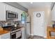 Well-equipped kitchen features stainless steel appliances and warm wood countertops at 779 Peregrine Falcon St, Henderson, NV 89015