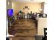 Spacious living room with wood-look flooring and cozy seating at 779 Peregrine Falcon St, Henderson, NV 89015