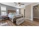 Serene bedroom with a ceiling fan, ensuite bathroom, and stylish furnishings at 779 Peregrine Falcon St, Henderson, NV 89015