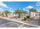 Community pool area with palm trees and ample parking for residents and guests at 779 Peregrine Falcon St, Henderson, NV 89015
