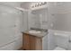 Bathroom features a single sink vanity, shower, and tiled floors at 7950 W Flamingo Rd # 1077, Las Vegas, NV 89147