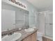 Bathroom features a double sink vanity, shower, and tiled floors at 7950 W Flamingo Rd # 1077, Las Vegas, NV 89147