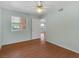 Bright bedroom featuring wood floors, ceiling fan, and a window with blinds at 7950 W Flamingo Rd # 1077, Las Vegas, NV 89147