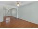 Bedroom featuring wood floors, ceiling fan, and mirrored closet doors at 7950 W Flamingo Rd # 1077, Las Vegas, NV 89147