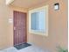 Charming front entrance features a secure door, window, and well-maintained stucco exterior at 7950 W Flamingo Rd # 1077, Las Vegas, NV 89147