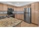 Bright kitchen with stainless steel appliances and beautiful granite countertops at 7950 W Flamingo Rd # 1077, Las Vegas, NV 89147