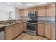Bright kitchen featuring stainless steel appliances and tile flooring at 7950 W Flamingo Rd # 1077, Las Vegas, NV 89147