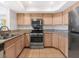 Bright kitchen featuring stainless steel appliances and tile flooring at 7950 W Flamingo Rd # 1077, Las Vegas, NV 89147