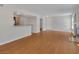 Spacious living room with wood floors, open concept layout, and a fireplace at 7950 W Flamingo Rd # 1077, Las Vegas, NV 89147