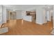 Spacious open-concept living area with hardwood floors, open layout to the kitchen, and natural light at 7950 W Flamingo Rd # 1077, Las Vegas, NV 89147