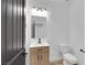 Modern bathroom features a vanity with a square sink and a framed mirror at 8043 Tank Loop St, Las Vegas, NV 89166
