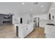 Modern kitchen featuring a large island, stainless steel appliances, and sleek finishes at 8043 Tank Loop St, Las Vegas, NV 89166