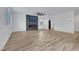 Expansive living area showcasing a modern fireplace and views of the adjacent bright kitchen at 8043 Tank Loop St, Las Vegas, NV 89166