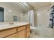 Functional bathroom with a vanity, sink, toilet and shower over tub with curtain at 8105 Tropic Isle Cir, Las Vegas, NV 89128