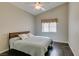Comfortable bedroom with a bed, wood floors, and a window with curtains at 8105 Tropic Isle Cir, Las Vegas, NV 89128