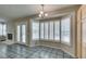 A bright breakfast nook features plantation shutters, tile flooring, and a modern chandelier at 8105 Tropic Isle Cir, Las Vegas, NV 89128