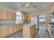 Bright kitchen boasts light wood cabinetry, an island, and modern appliances at 8105 Tropic Isle Cir, Las Vegas, NV 89128