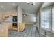 An open kitchen area features double ovens, breakfast nook with fireplace, and tiled flooring at 8105 Tropic Isle Cir, Las Vegas, NV 89128