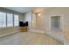 Open-concept living room with plank floors, natural light, neutral paint, and easy access to other rooms at 8105 Tropic Isle Cir, Las Vegas, NV 89128