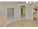Open-concept layout showing the living room with tile floor, columns, and view to the kitchen at 8105 Tropic Isle Cir, Las Vegas, NV 89128