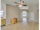 View of the living room with wood flooring, ceiling fan, and view to other areas of the home at 8105 Tropic Isle Cir, Las Vegas, NV 89128