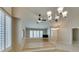 View of bright living room area with wood floors, plantation shutters, and open floor plan at 8105 Tropic Isle Cir, Las Vegas, NV 89128