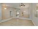 Inviting living area with plank floors, neutral walls, open floor plan, and a view to dining room at 8105 Tropic Isle Cir, Las Vegas, NV 89128