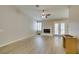 Large living room area with fireplace, wood flooring, plantation shutters, and back patio access at 8105 Tropic Isle Cir, Las Vegas, NV 89128