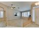 Spacious living area with vaulted ceiling, plank floors, neutral walls, and several bright windows at 8105 Tropic Isle Cir, Las Vegas, NV 89128