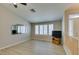 Bright living room with plank floors, vaulted ceiling, plantation shutters and light neutral colored walls at 8105 Tropic Isle Cir, Las Vegas, NV 89128