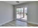 Bright room with large sliding glass door overlooking the backyard with a patio and manicured lawn at 8108 Artistic Heights Ct, Las Vegas, NV 89143