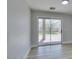 A large sliding door reveals a backyard with a manicured lawn and a paved patio area at 8108 Artistic Heights Ct, Las Vegas, NV 89143