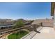 Elevated backyard view featuring a well-maintained lawn and neighborhood rooftops at 8108 Artistic Heights Ct, Las Vegas, NV 89143