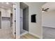 Modern bathroom with tiled shower, glass door and stylish fixtures, adjacent to the Primary closet at 8108 Artistic Heights Ct, Las Vegas, NV 89143