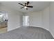 Spacious, carpeted bedroom with an open doorway and a view into the stylish bathroom at 8108 Artistic Heights Ct, Las Vegas, NV 89143