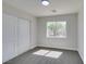 Comfortable bedroom with soft carpet, natural light from a window, and ample closet space at 8108 Artistic Heights Ct, Las Vegas, NV 89143