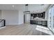 Open concept kitchen features stainless appliances, gray cabinets, and natural light from large sliding glass doors at 8108 Artistic Heights Ct, Las Vegas, NV 89143