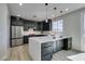 Well-appointed kitchen with a center island, stainless appliances, and contemporary finishes at 8108 Artistic Heights Ct, Las Vegas, NV 89143