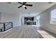 Spacious living area connecting to a modern kitchen with stainless steel appliances at 8108 Artistic Heights Ct, Las Vegas, NV 89143
