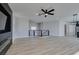 Open concept living space with modern fireplace and stairway at 8108 Artistic Heights Ct, Las Vegas, NV 89143