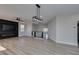 Spacious open living area with wood-look floors and modern accents at 8108 Artistic Heights Ct, Las Vegas, NV 89143