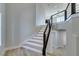 Bright staircase with light wood-look floors and modern railings leading to upper level at 8108 Artistic Heights Ct, Las Vegas, NV 89143