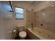 Relax in this bathroom's soaking tub with tile surround and a window providing natural light at 8218 Golden Flowers St, Las Vegas, NV 89139