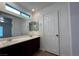 Bright bathroom features a double vanity with solid surface counter and plenty of space at 8218 Golden Flowers St, Las Vegas, NV 89139