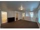 Upstairs loft area with carpet, neutral paint, and access to bathroom, laundry and bedrooms at 8218 Golden Flowers St, Las Vegas, NV 89139
