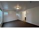 Loft area with neutral carpet, bright lighting, and access to adjacent rooms at 8218 Golden Flowers St, Las Vegas, NV 89139
